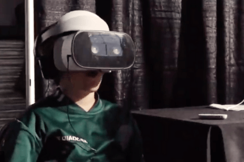 Kid trying VR Lounge optics