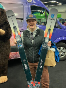 a woman holding a pair of skis at Snowvana